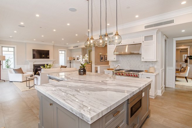 open-kitchen-with-l-shape-island-and-marble-counters